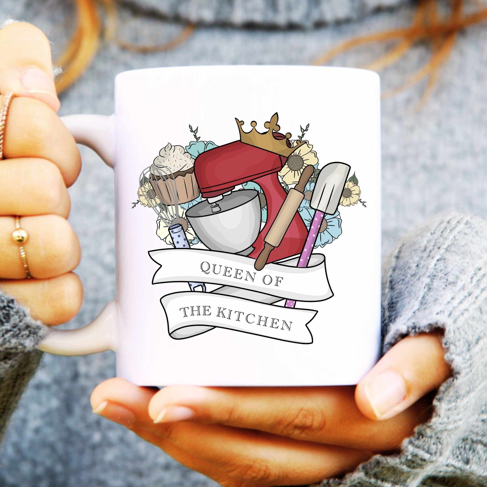 Mug with 'Queen of the Kitchen' design held by a person