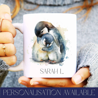 Person holding a mug with personalised name and penguin design, text reads personalisation available.