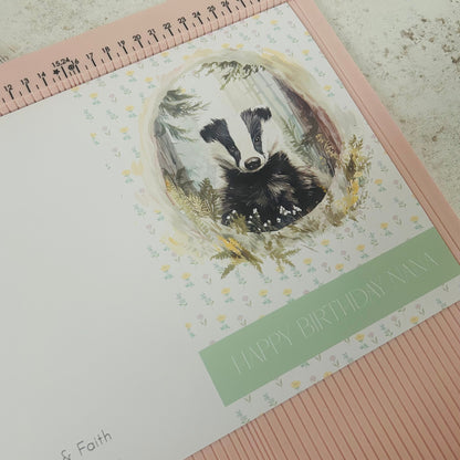 Greeting card with a badger illustration and 'Happy Birthday Nana' text on a floral background.