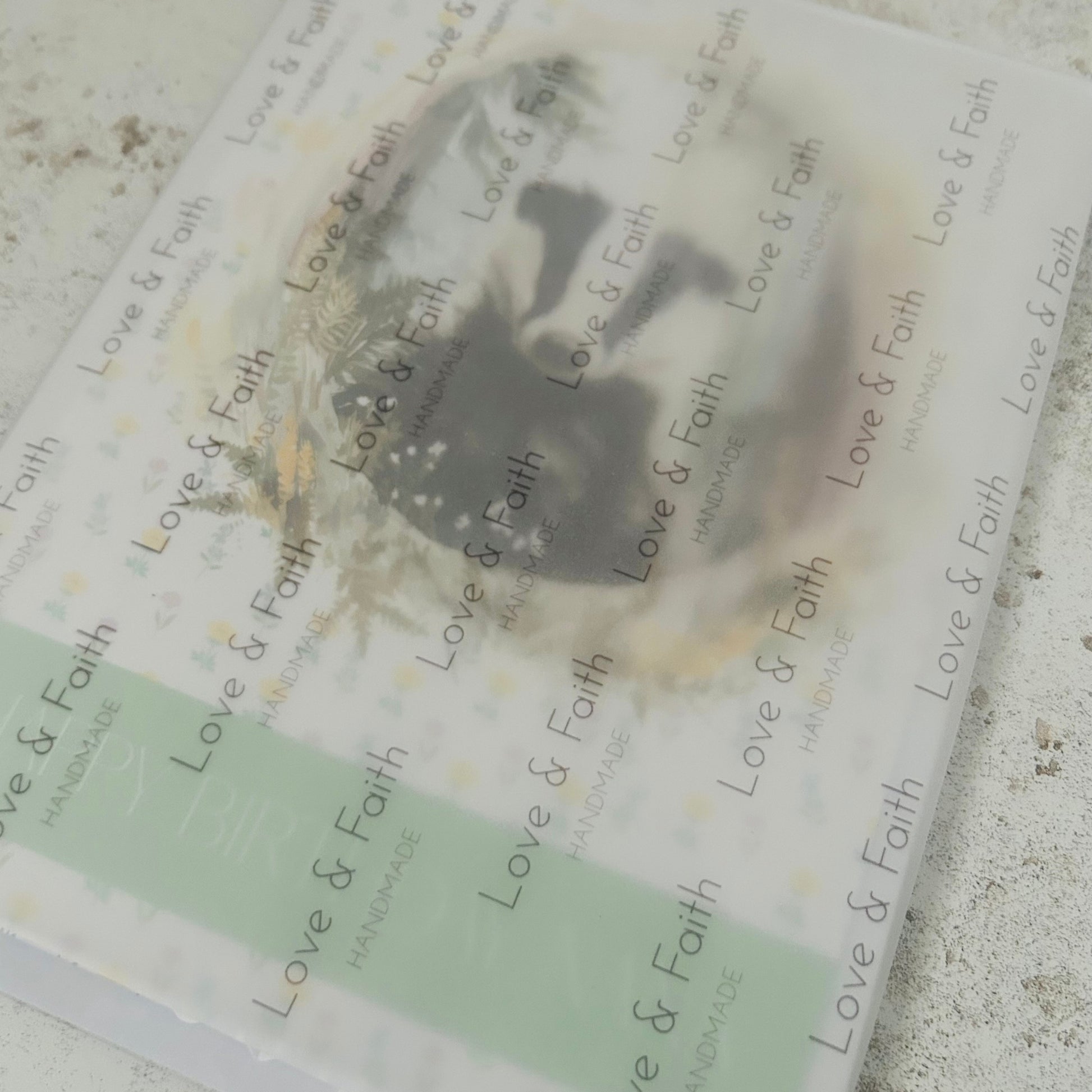 Product packaging with 'Love & Faith' branding on a textured surface