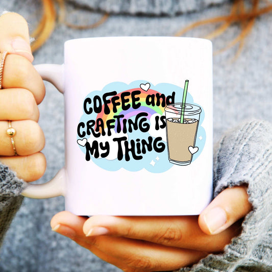 White ceramic mug with a coffee cup, text reads "coffee and crafting is my thing"