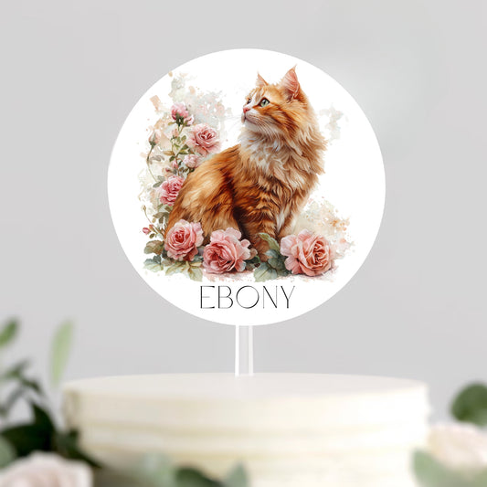 Cake topper with a ginger cat and floral design, featuring the name 'Ebony'.