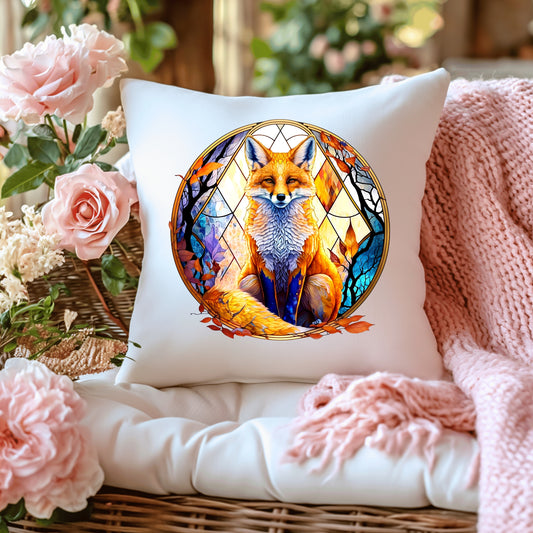 Decorative cushion with a fox design on a surface with flowers and a blanket.