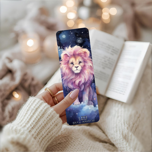 Person holding a bookmark with a lion design and Leo wording against a cosy background.