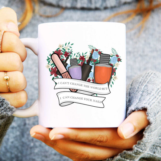 Person holding a mug with nail polish illustrations and text.