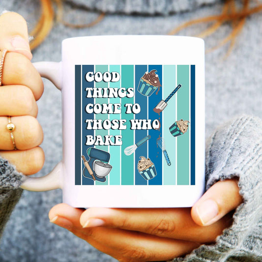 Person holding a mug with baking-themed design and text