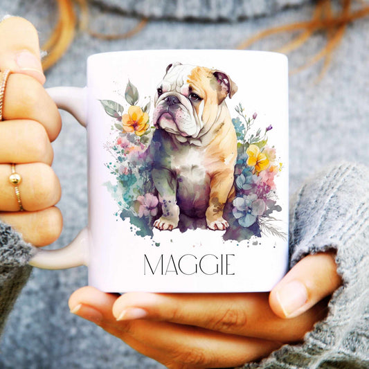Person holding a mug with an English bulldog illustration and the name 'Maggie' on it.