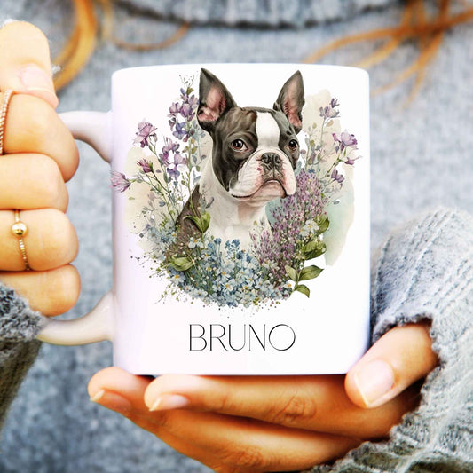 Person holding a mug with a Boston terrier dog watercolour illustration and 'BRUNO' text