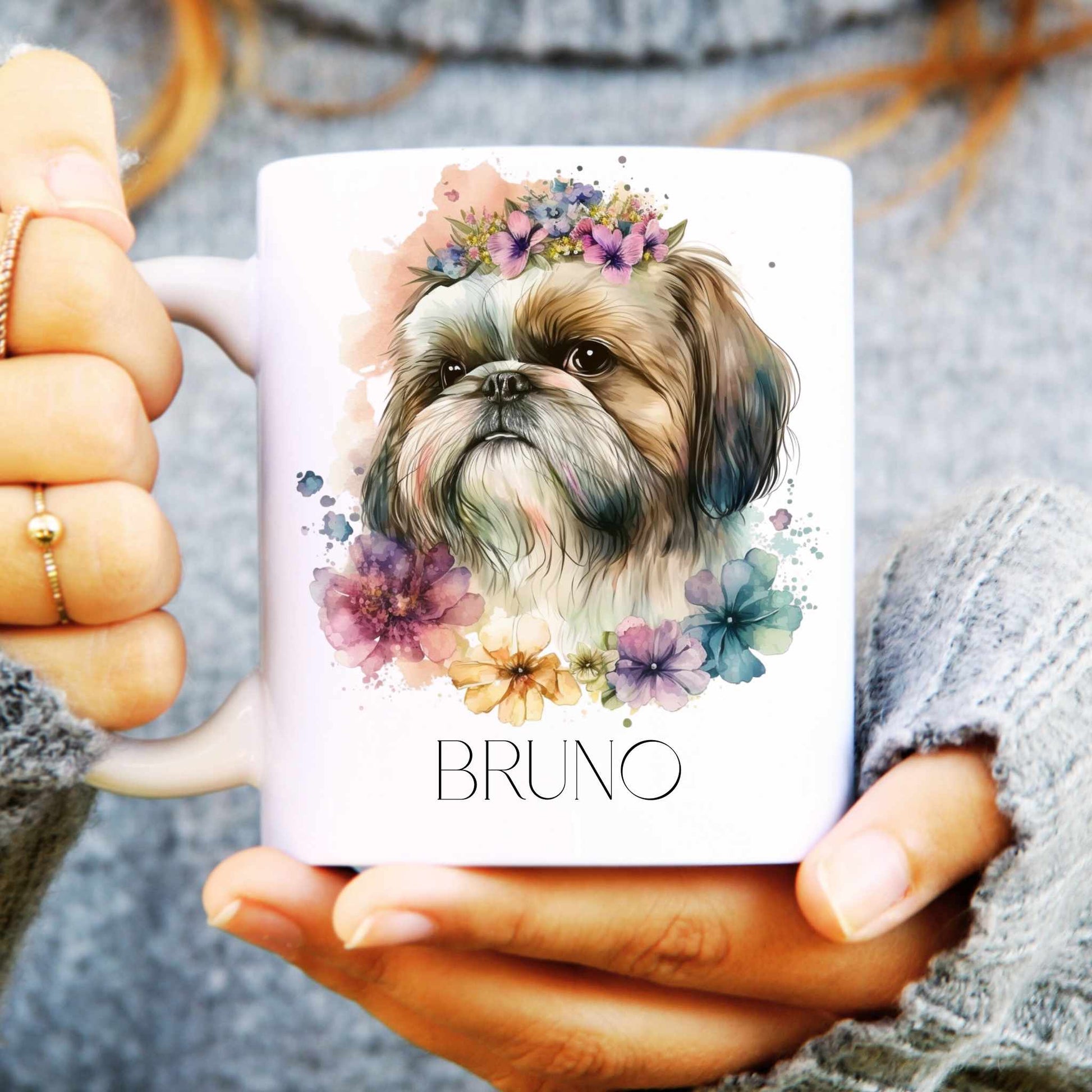Person holding a mug with a Shih Tzu dog illustration and 'BRUNO' text