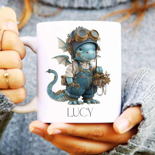 White ceramic mug held in hands with steampunk dragon design and a name on the bottom.