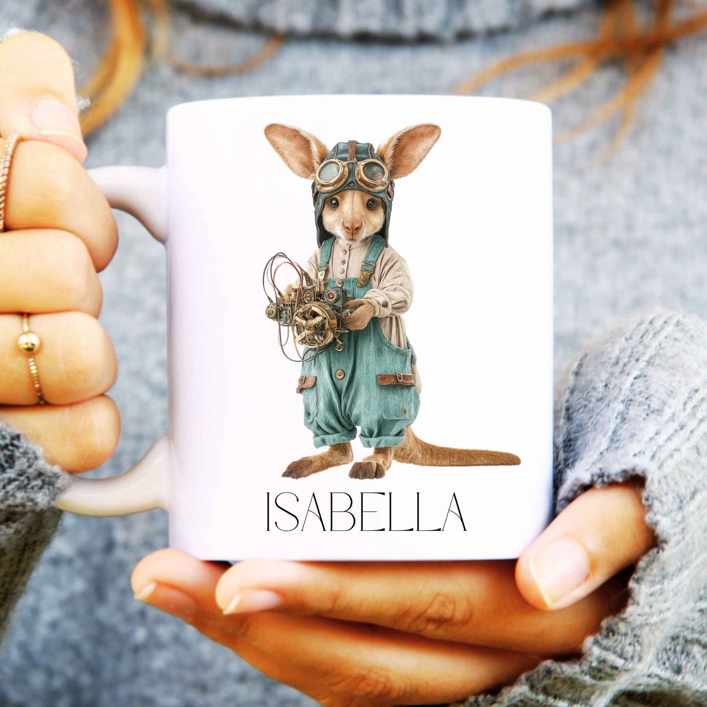 Coffee mug being held in hands with steampunk kangaroo design and a name personalised onto it.