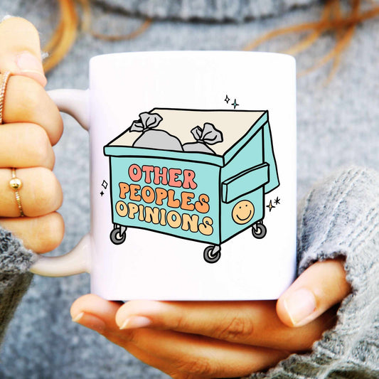 White ceramic mug with a large bin with text reading other people opinions representing positive mindset