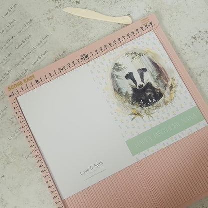 Greetings card with a badger illustration on a textured surface