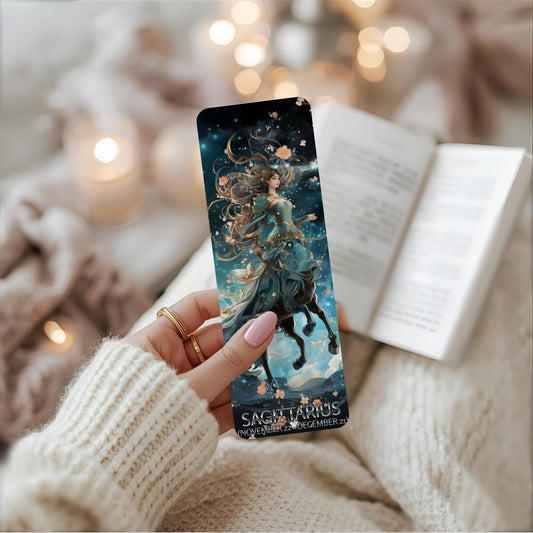 Hand holding a Sagittarius zodiac bookmark with a blurred cosy background.
