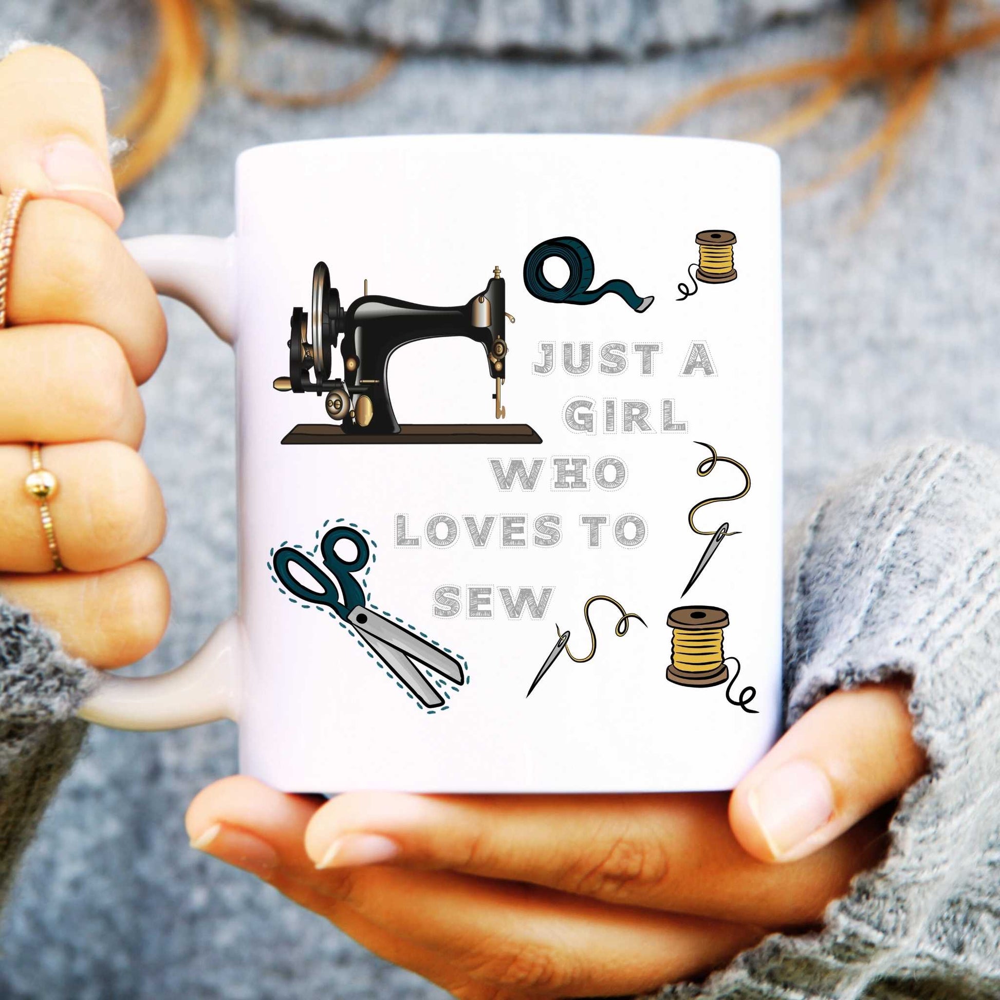 Person holding a mug with sewing-themed design and text 'Just a girl who loves to sew'.