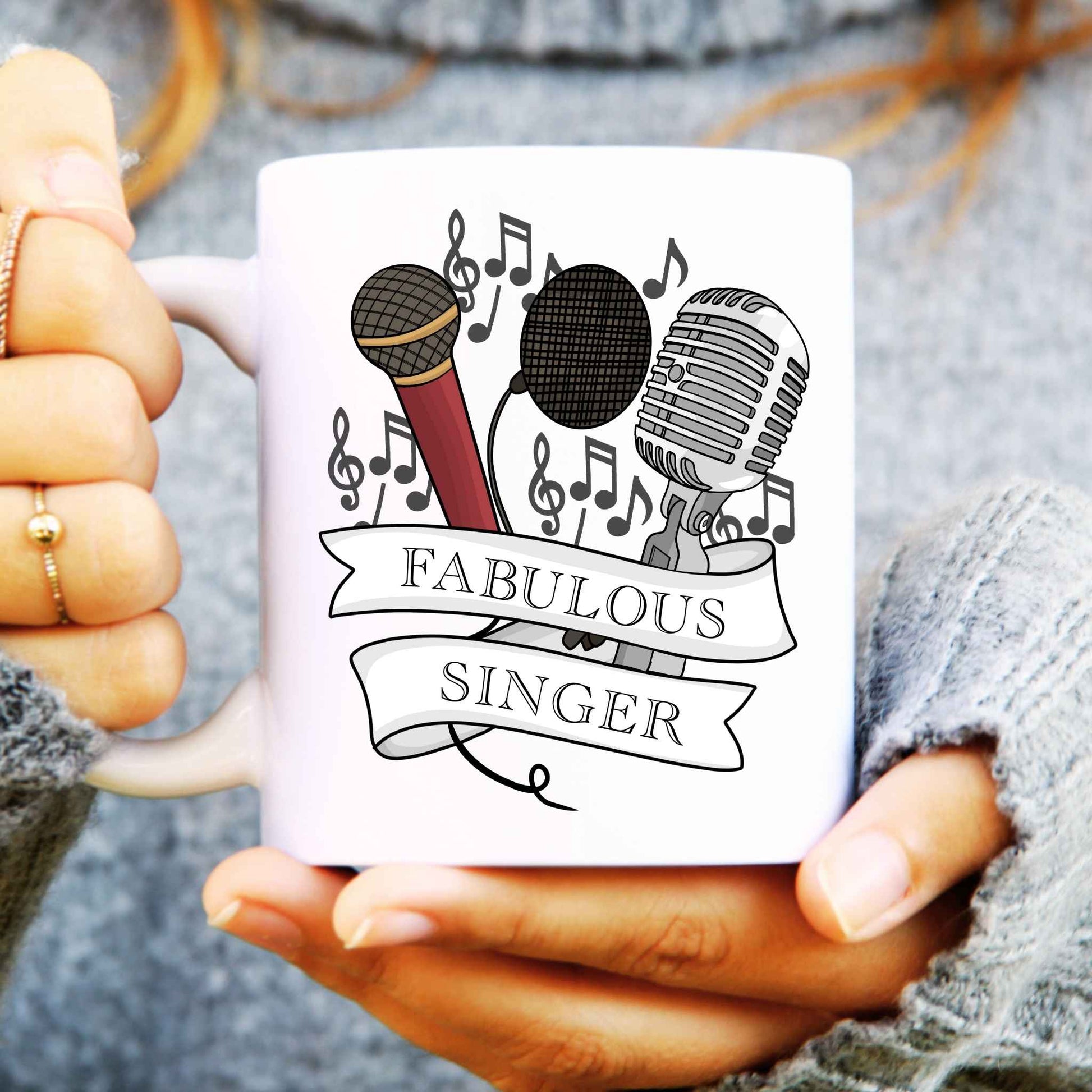 White mug with microphone design and 'Fabulous Singer' text held by hands.