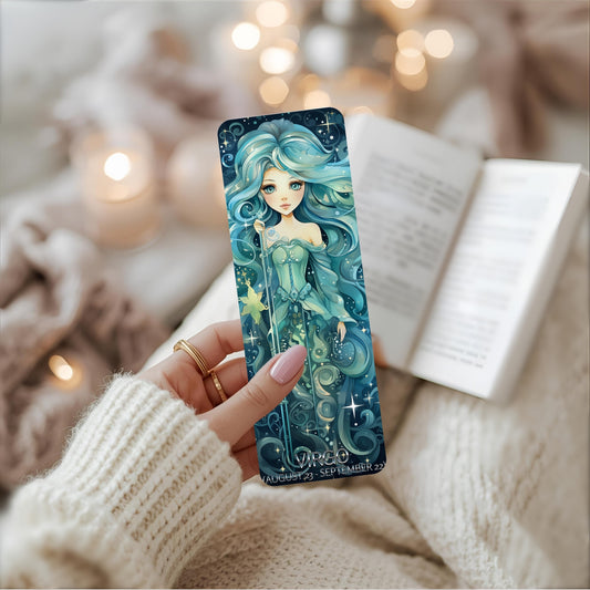 Person holding a Virgo bookmark with an illustration of a mermaid in a cosy setting.