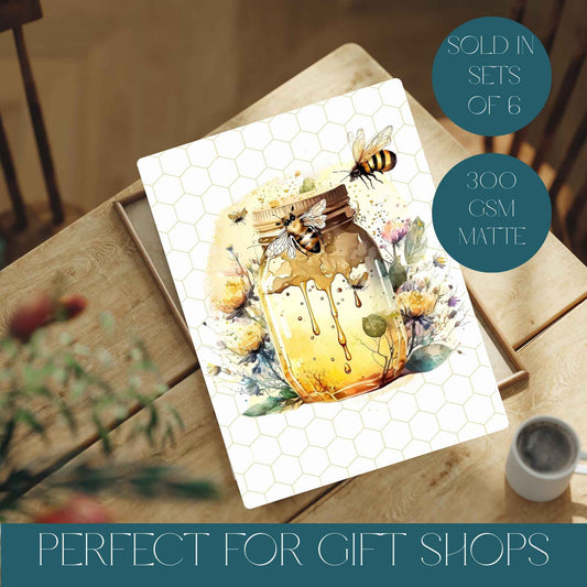Image of a bee print with honeycomb background, honey pot and pretty watercolour bees.