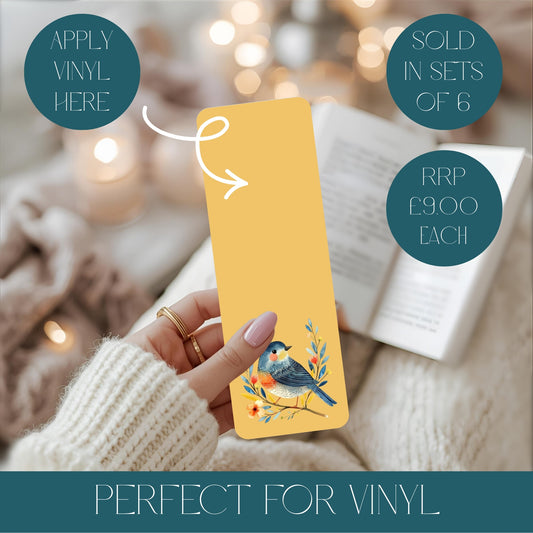Yellow aluminium bookmark with a bird design held by a person, with text about vinyl application and pricing.