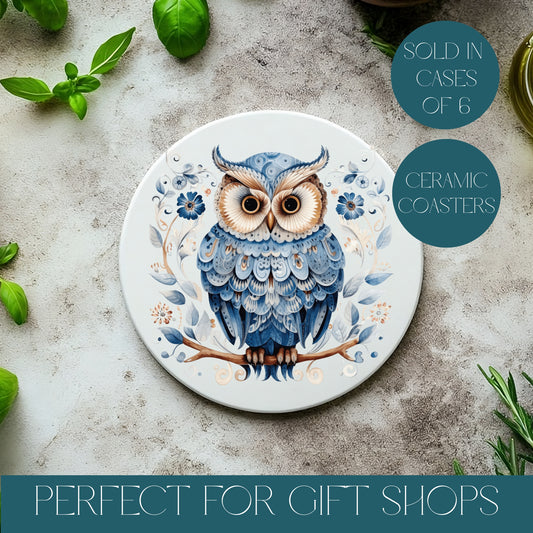 Ceramic coaster with owl design on a textured surface with basil leaves. Text reads sold in cases of 6