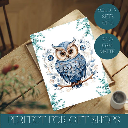 Print with a blue owl design on a wooden surface with text about quantity and material.