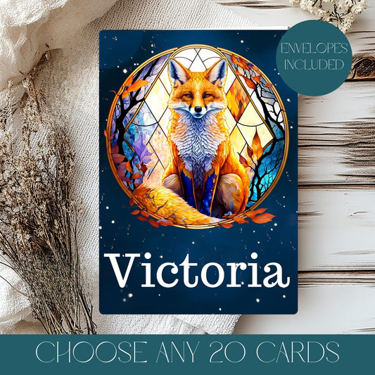 Card with a fox illustration and 'Victoria' text on a wooden surface.Text reads choose any 20 cards.