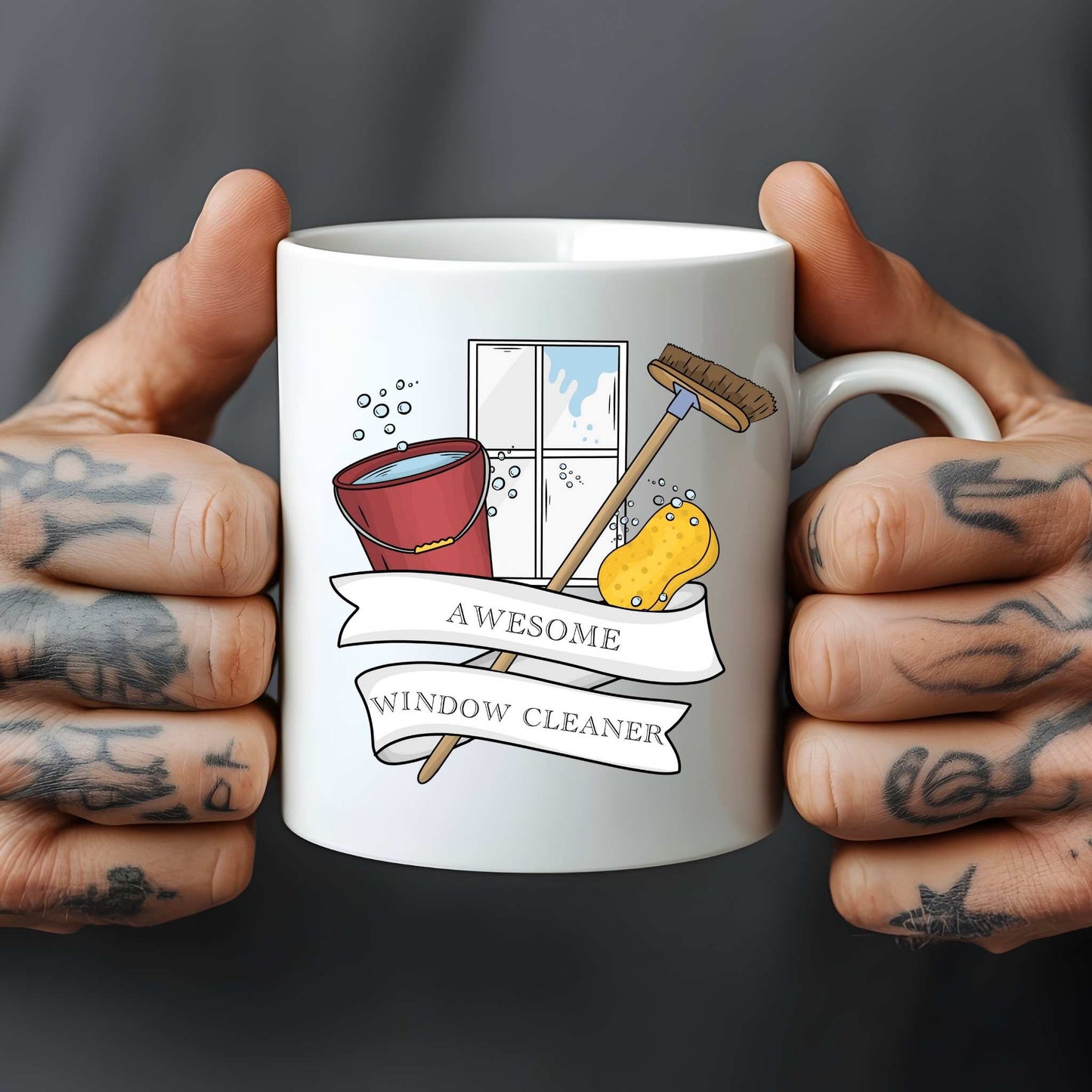 White mug held by tattooed hands with a cartoon design featuring a broom and bucket cleaning a window, text reads awesome window cleaner.